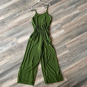 Green tank top jumpsuit with pockets.
